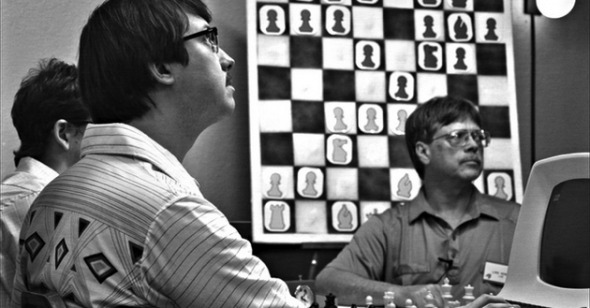 Man playing chess against computer - Stock Image - Everypixel